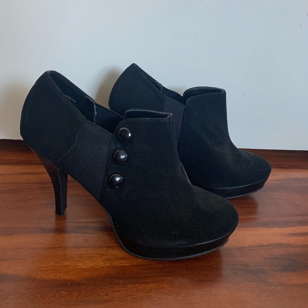 black heeled boots with buttons on the side